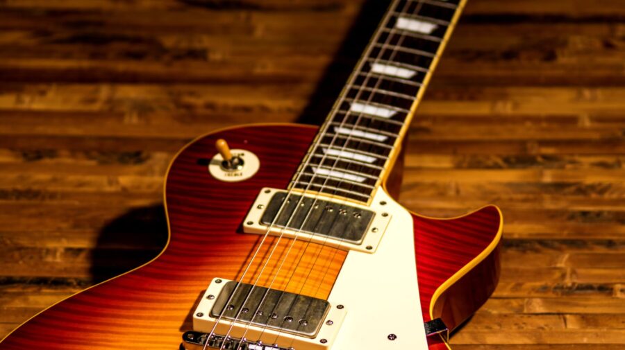 electric guitar body close-up view is on the wood floor