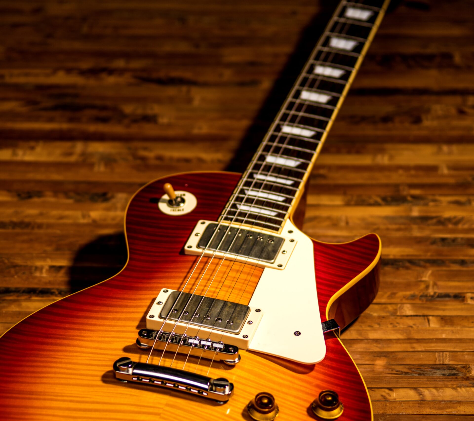 electric guitar body close-up view is on the wood floor