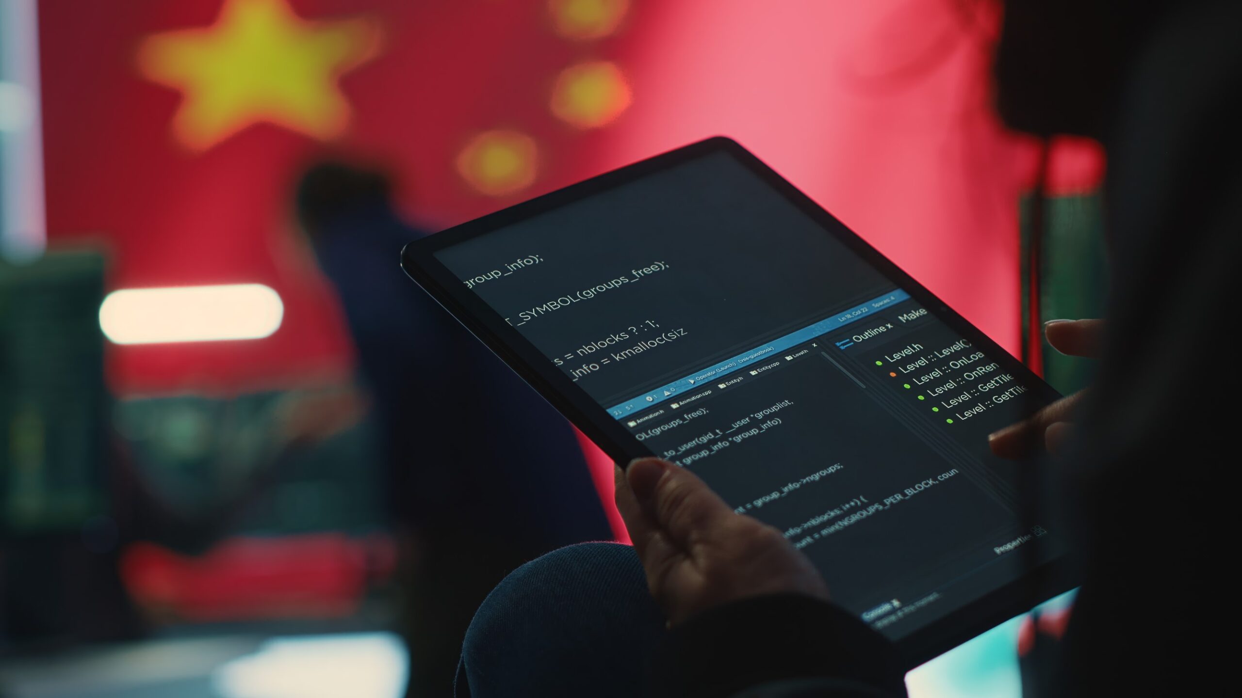 Chinese hacker uses a tablet in governmental cyber operations office
