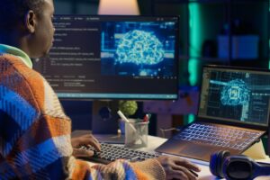Black man programmer manages code and scripts in artificial intelligence