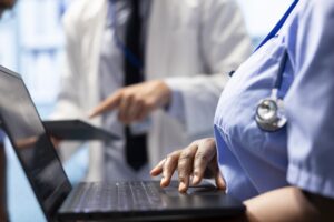 Doctor consulting with his team to examine x ray test results in office