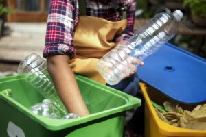 Closeup of hands separating plastic bottles